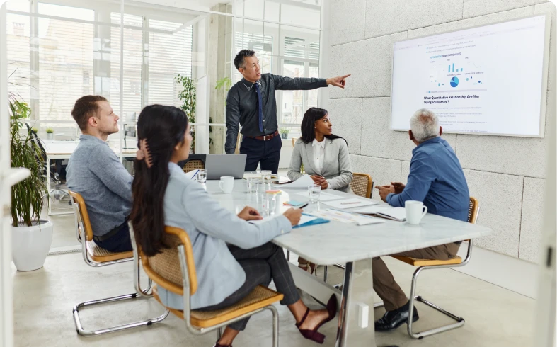 Business meeting presentation in modern conference room.