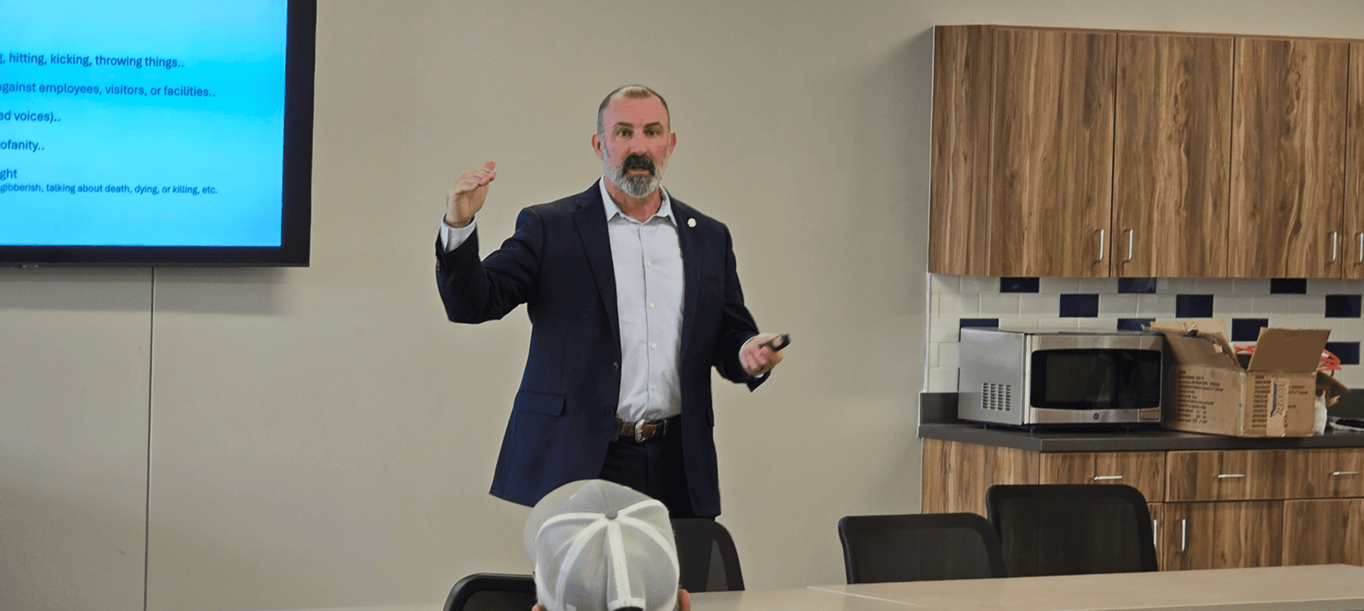 Man speaking during a presentation
